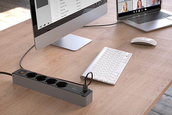 4-way power strip connected to desk